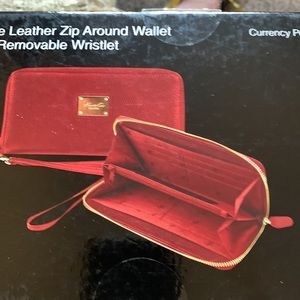 New, Leather zip around wallet with removable wristlet.